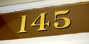 Traditional address numbers in Gold for transom windows by House Number Lab - Baltimore Style, 22K Gold Leaf, Customizable at housenumberlab.com