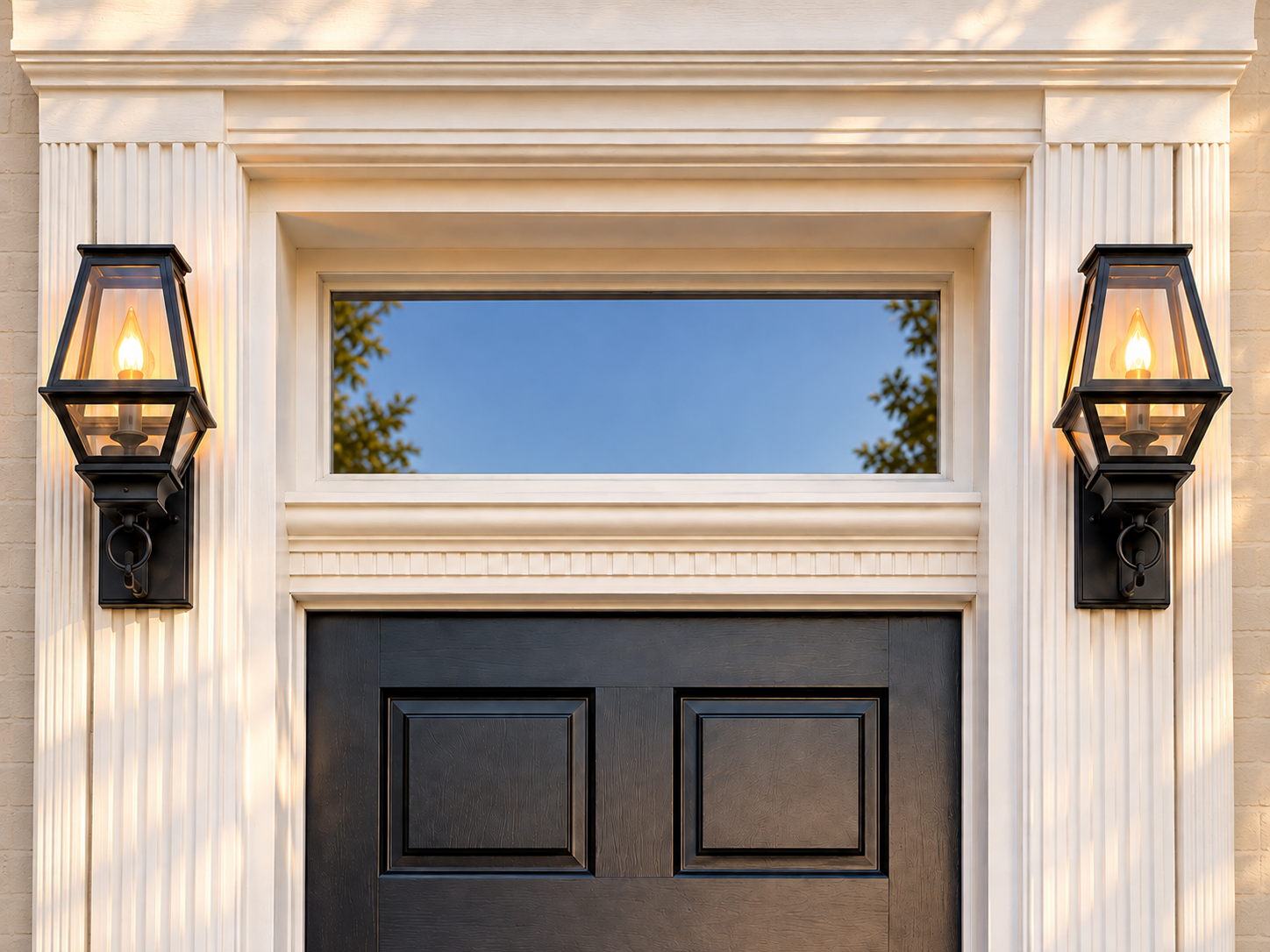 Example transom glass between two lanterns above a dark front door